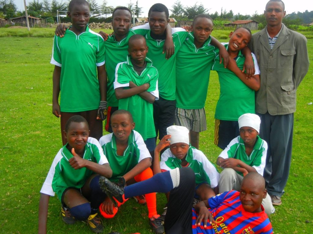 Boys in green football kits
