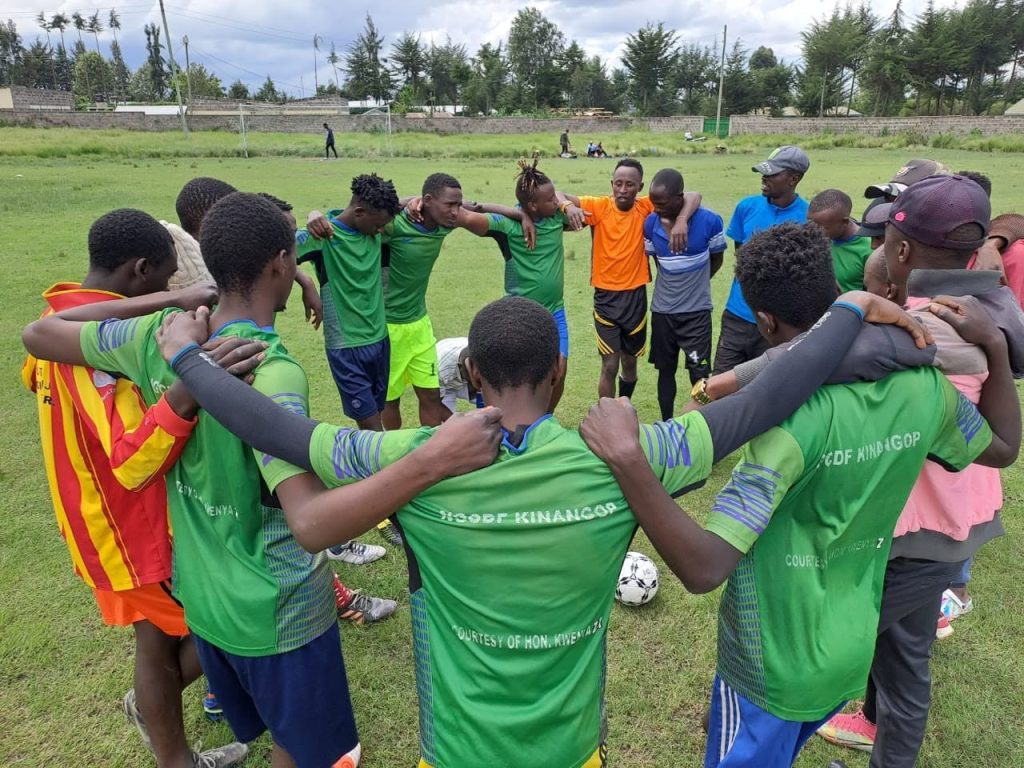 Boys in a team huddle
