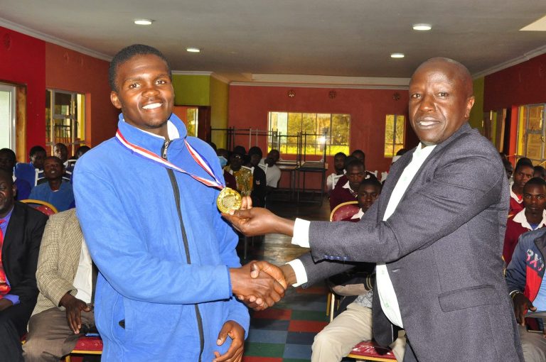 A young man receiving a medal